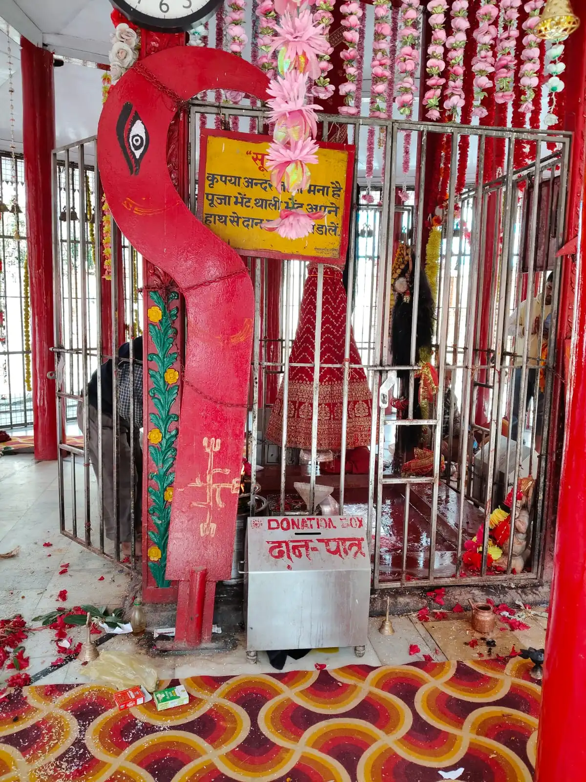 Kalimath temple garbha griha pickture with the khdag of maa kali kept in the front