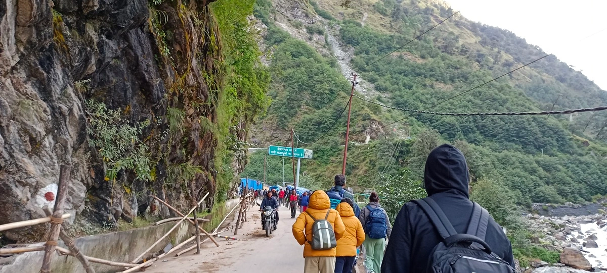 trekkers on the way to Kedarnath with all the protective layers and necessary items